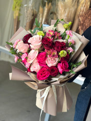 Two dozen mixed red roses bouquet